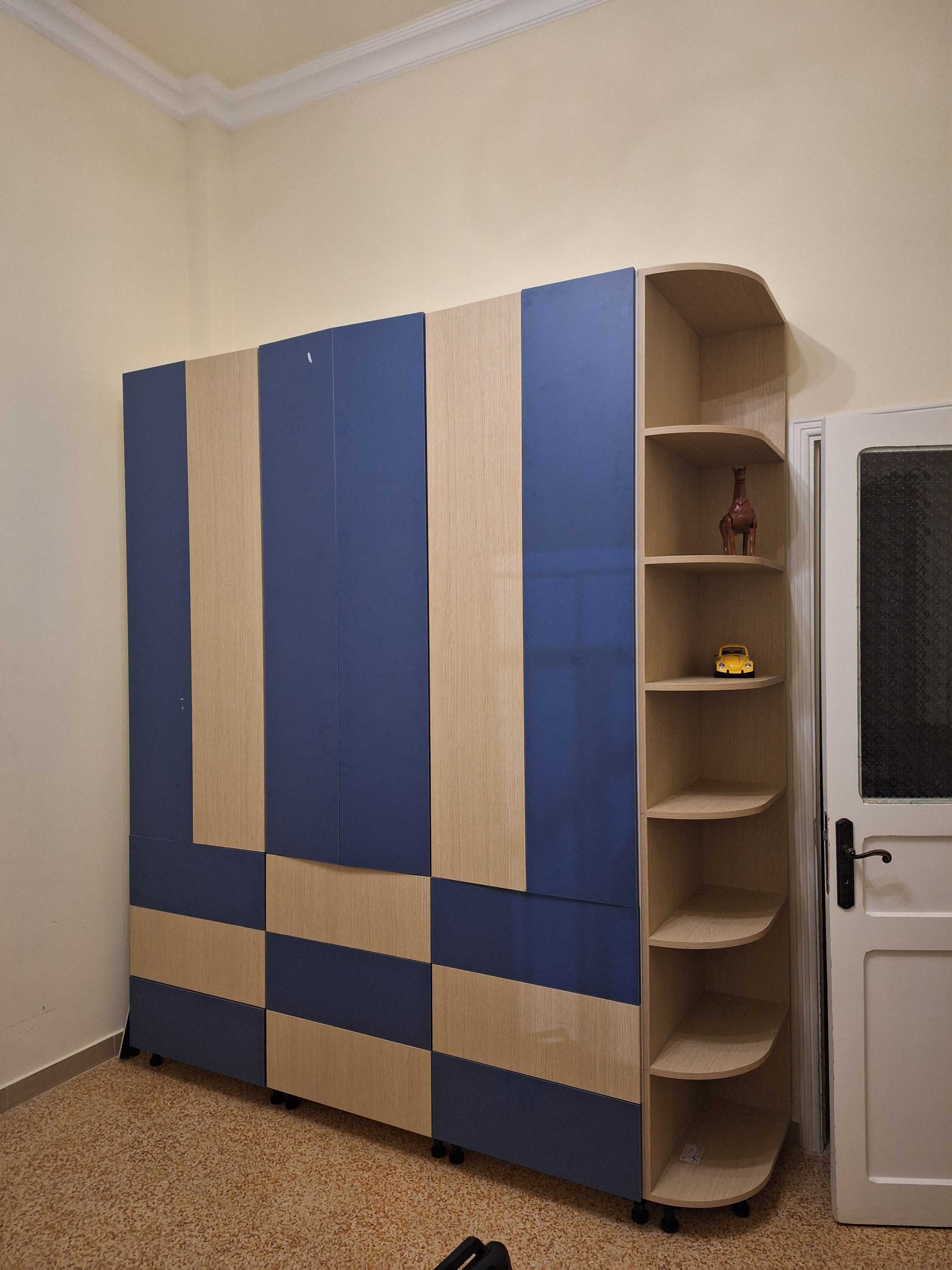 Blue and wood-grain kids' wardrobe with drawers and rounded open shelves